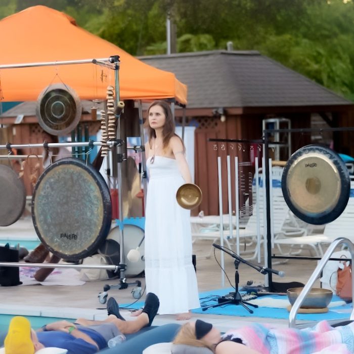 Diana Perov Sound Healer performing a floating sound bath in Dallas Texas